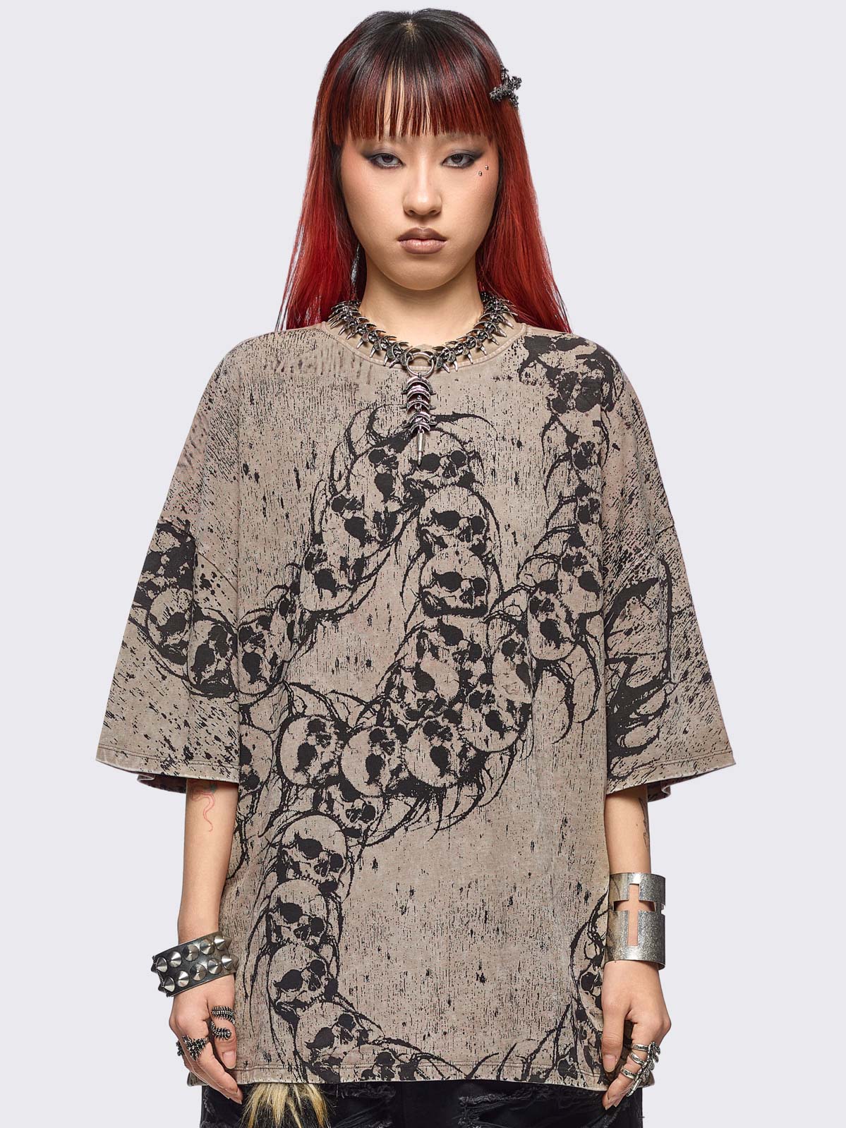 Beige oversize washed t-shirt featuring a skull centipede graphic front print front print.