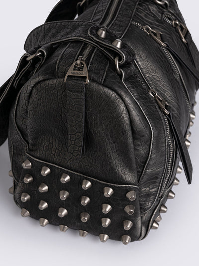 Black faux leather shoulder bag featuring stud and metal hardware details.