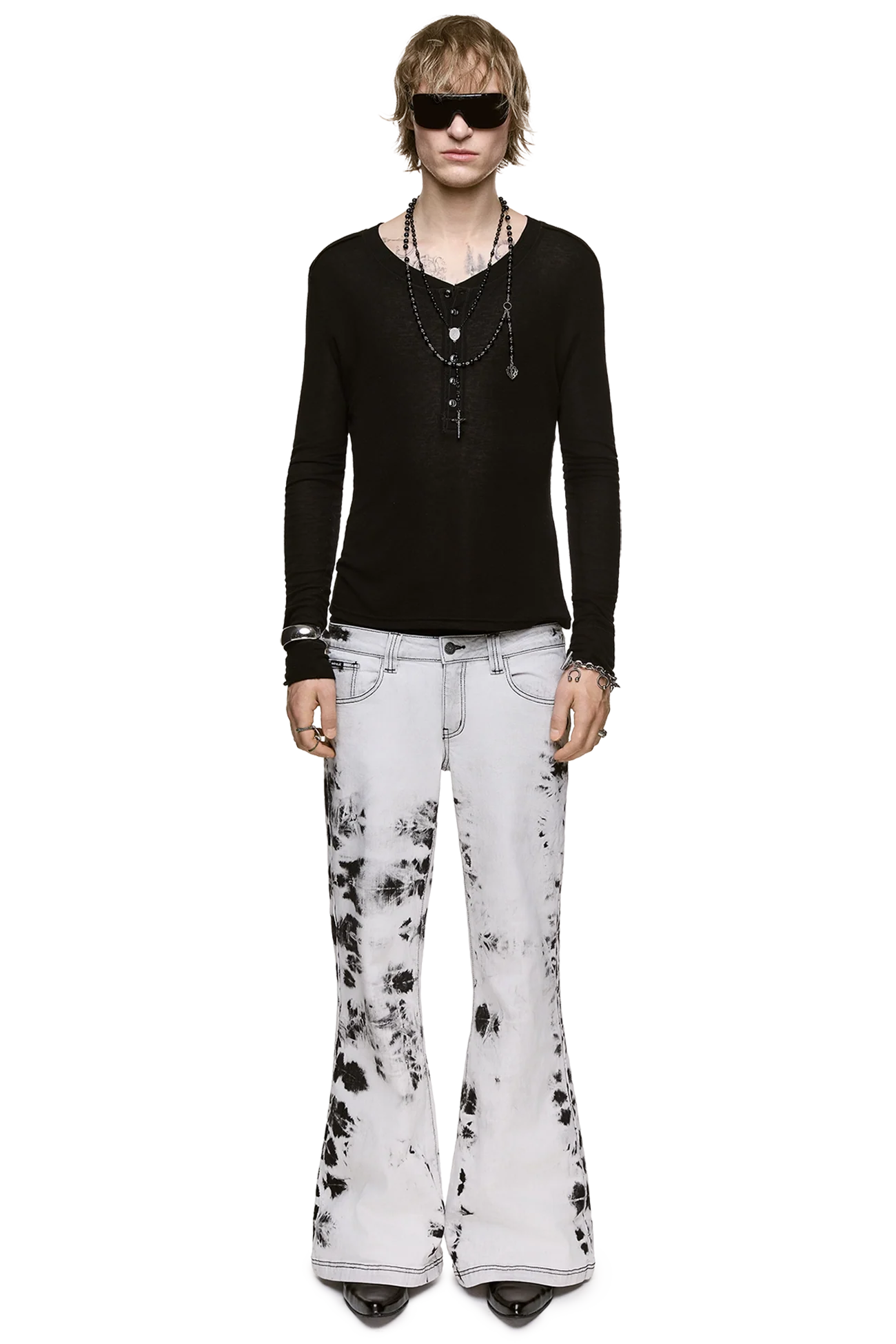Light gray stretch denim jeans with bleached tie-dye wash, low-rise waist and flared leg in a grunge Y2K style.