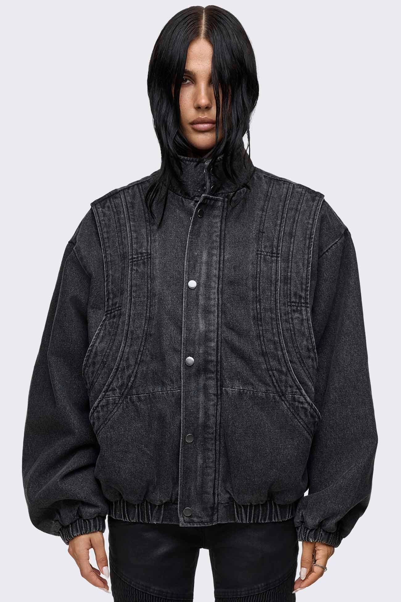 Black washed denim bomber jacket with layered detail, high collar, snap buttons, side pockets and an oversized fit.
