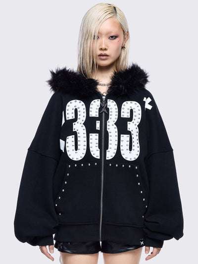 Black zip up hoodie jacket with faux fur hood and emoji heart front print in white.
