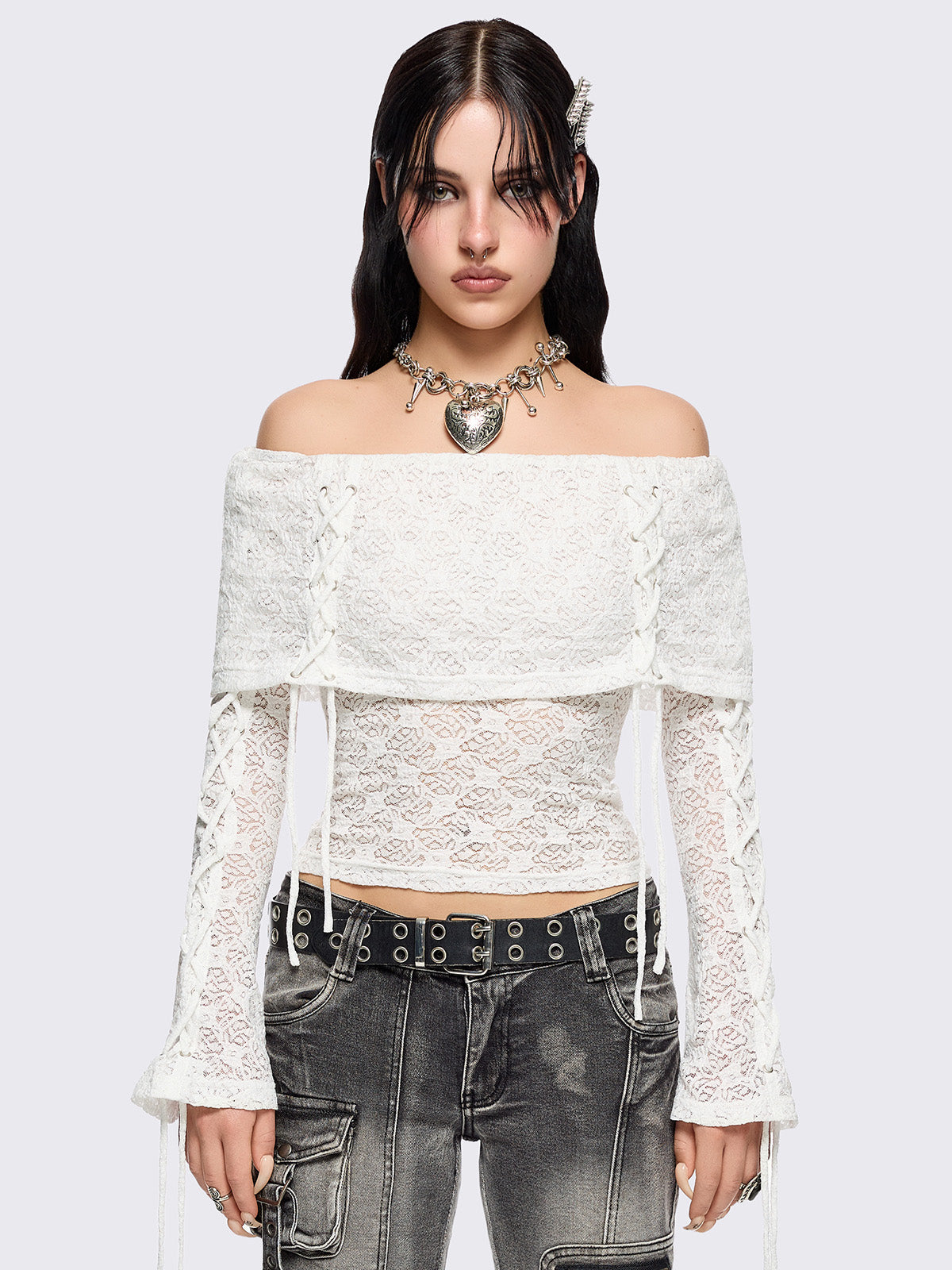 Off shoulder top in white lace construction. Bardot fold-over neck, lace up details and long flared sleeves.