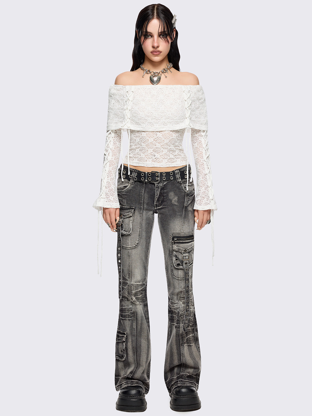 Off shoulder top in white lace construction. Bardot fold-over neck, lace up details and long flared sleeves.