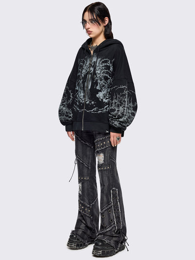 Black zip up hoodie jacket featuring a sacred figure graphic on front and thorn sleeve prints.