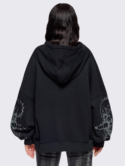 Black zip up hoodie jacket featuring a sacred figure graphic on front and thorn sleeve prints.