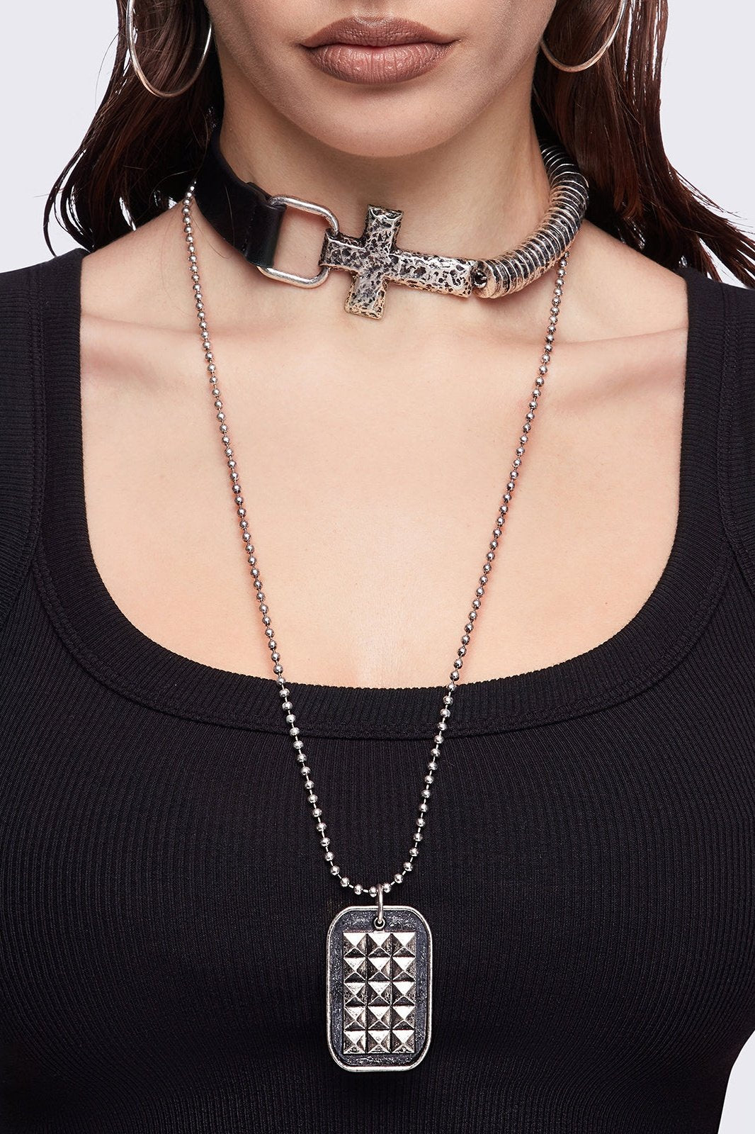 Set of 2 necklaces: Black faux leather choker with a cross buckle detail and a long ball chain necklace with dog-tag style pendant.