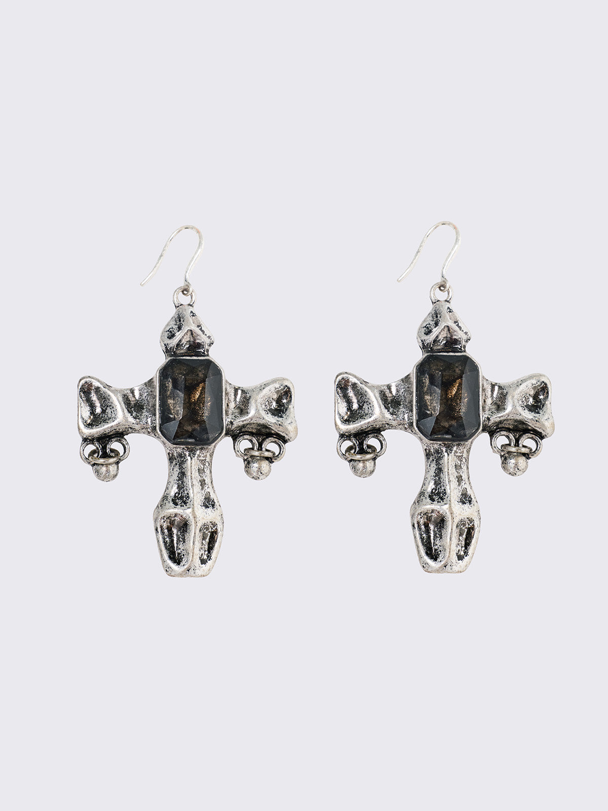 Pair of silver cross-shaped earrings with embedded stones.