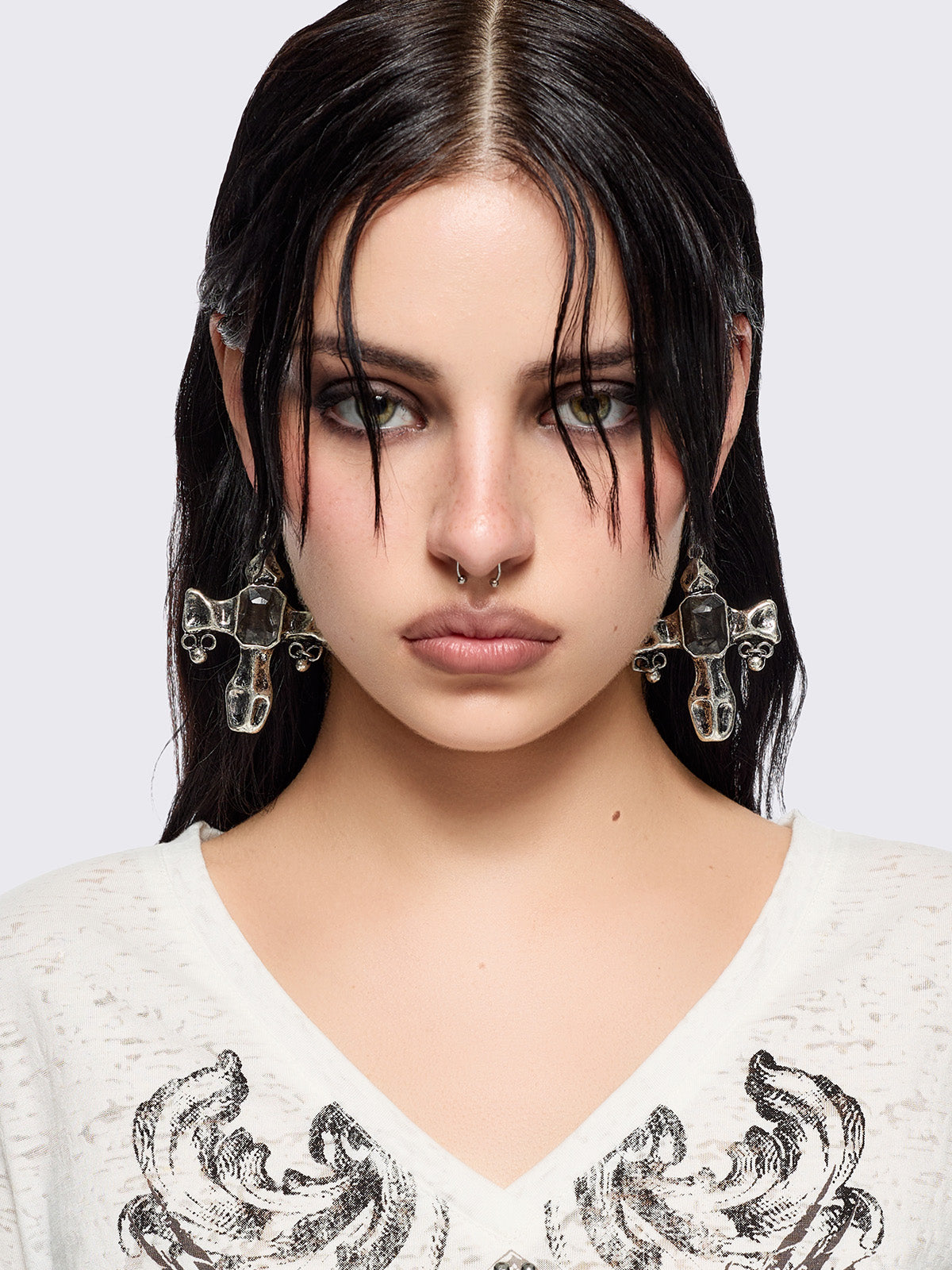 Chunky silver cross earrings with black stone.