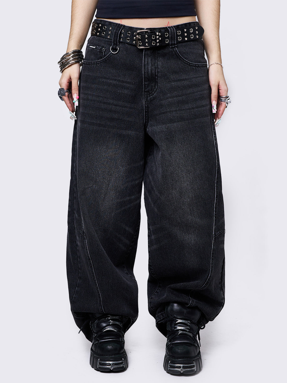 Black washed super baggy jeans with a relaxed fit, regular waist, zip fly, button fastening, and belt loops. Trendy streetwear style.