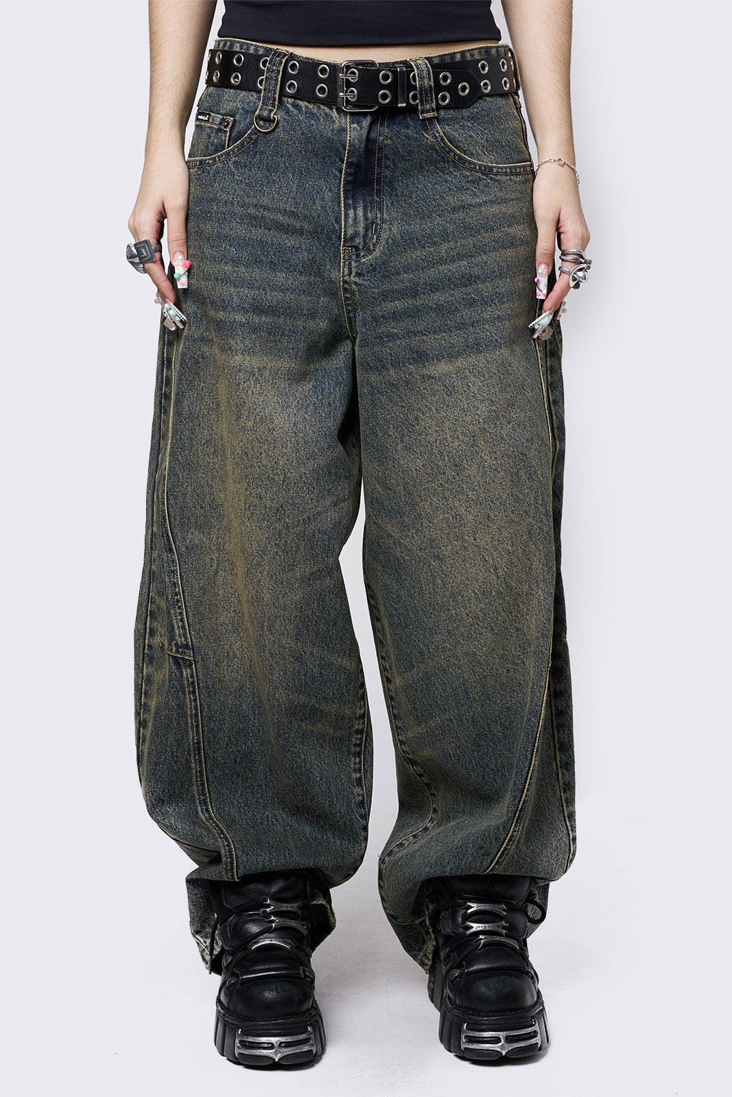 Blue washed super baggy jeans with green overdye, a relaxed fit, regular waist, zip fly, button fastening, and belt loops. Trendy streetwear style.