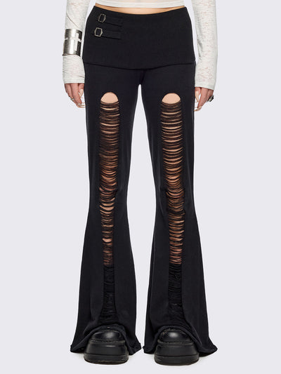 Black distressed flare pants with ribbed waistband. 