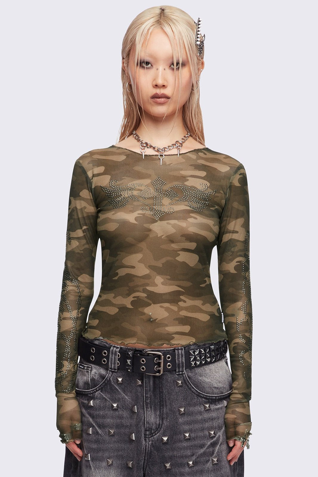 Camo printed mesh top with winged cross and rhinestone details.