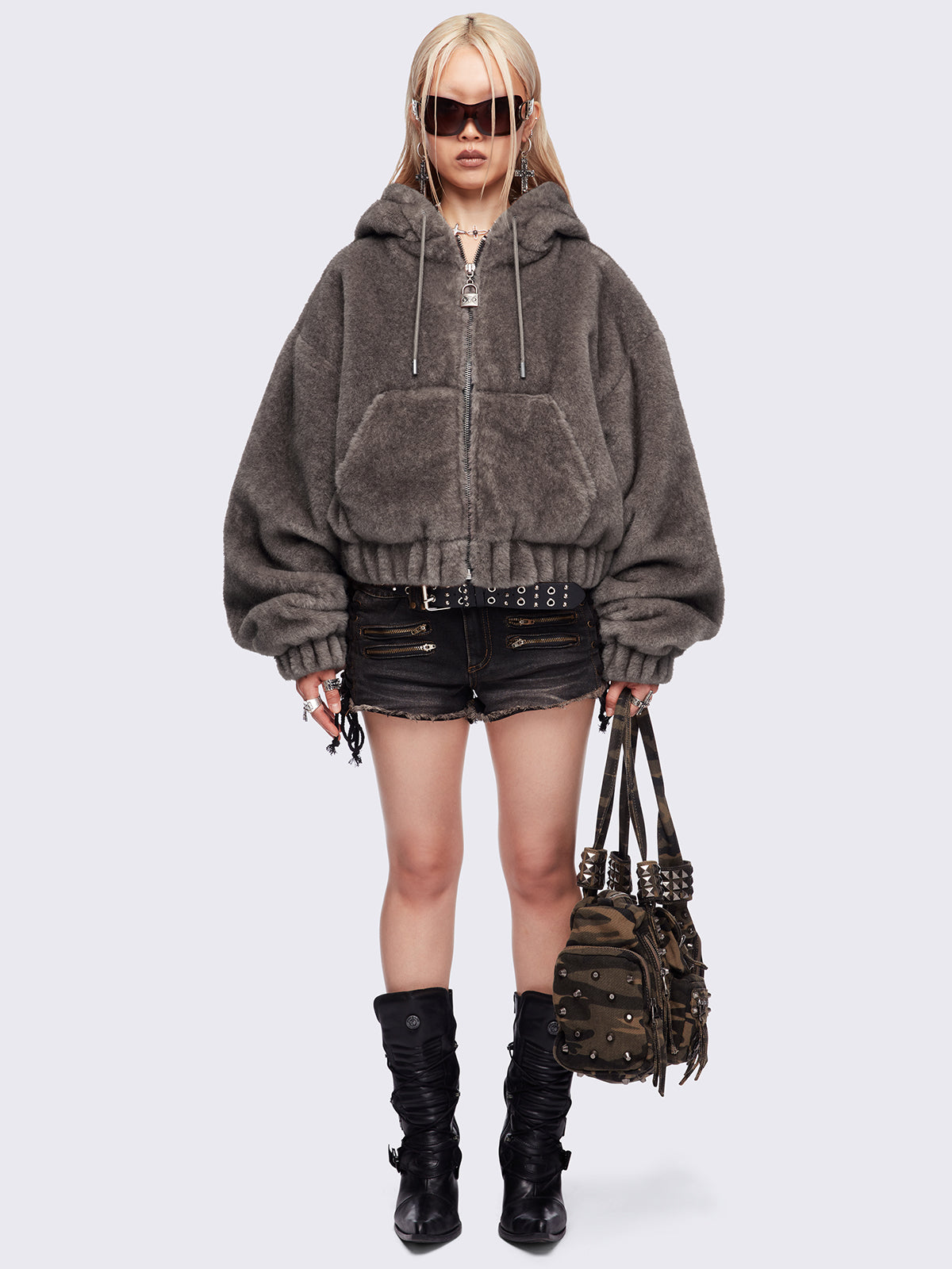 Brown oversize faux fur jacket with cat ear hood with piercing details.