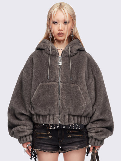 Brown oversize faux fur jacket with cat ear hood with piercing details.