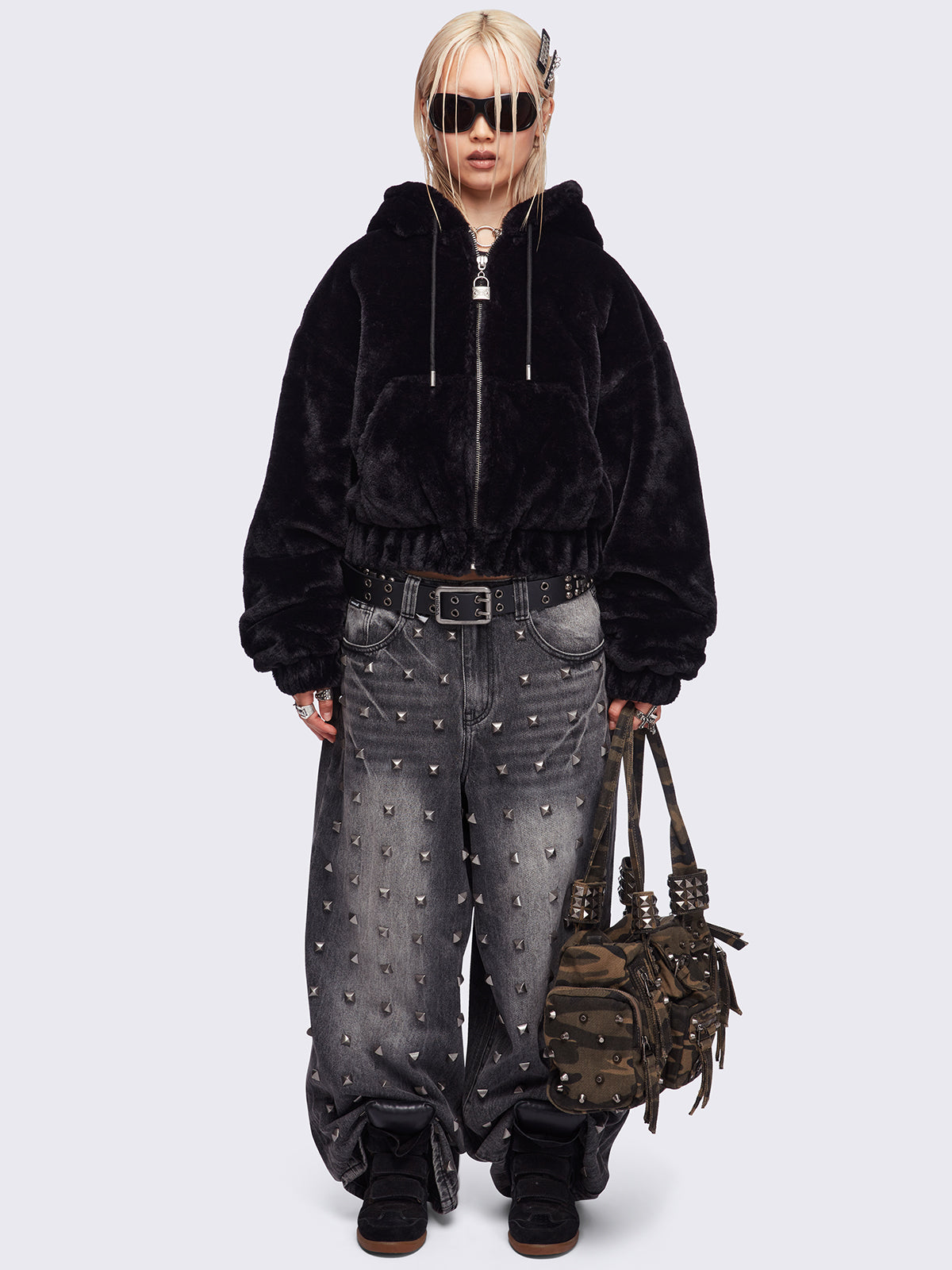 Black oversize faux fur jacket with cat ear hood with piercing details.