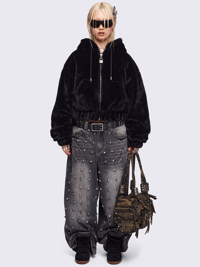 Black oversize faux fur jacket with cat ear hood with piercing details.