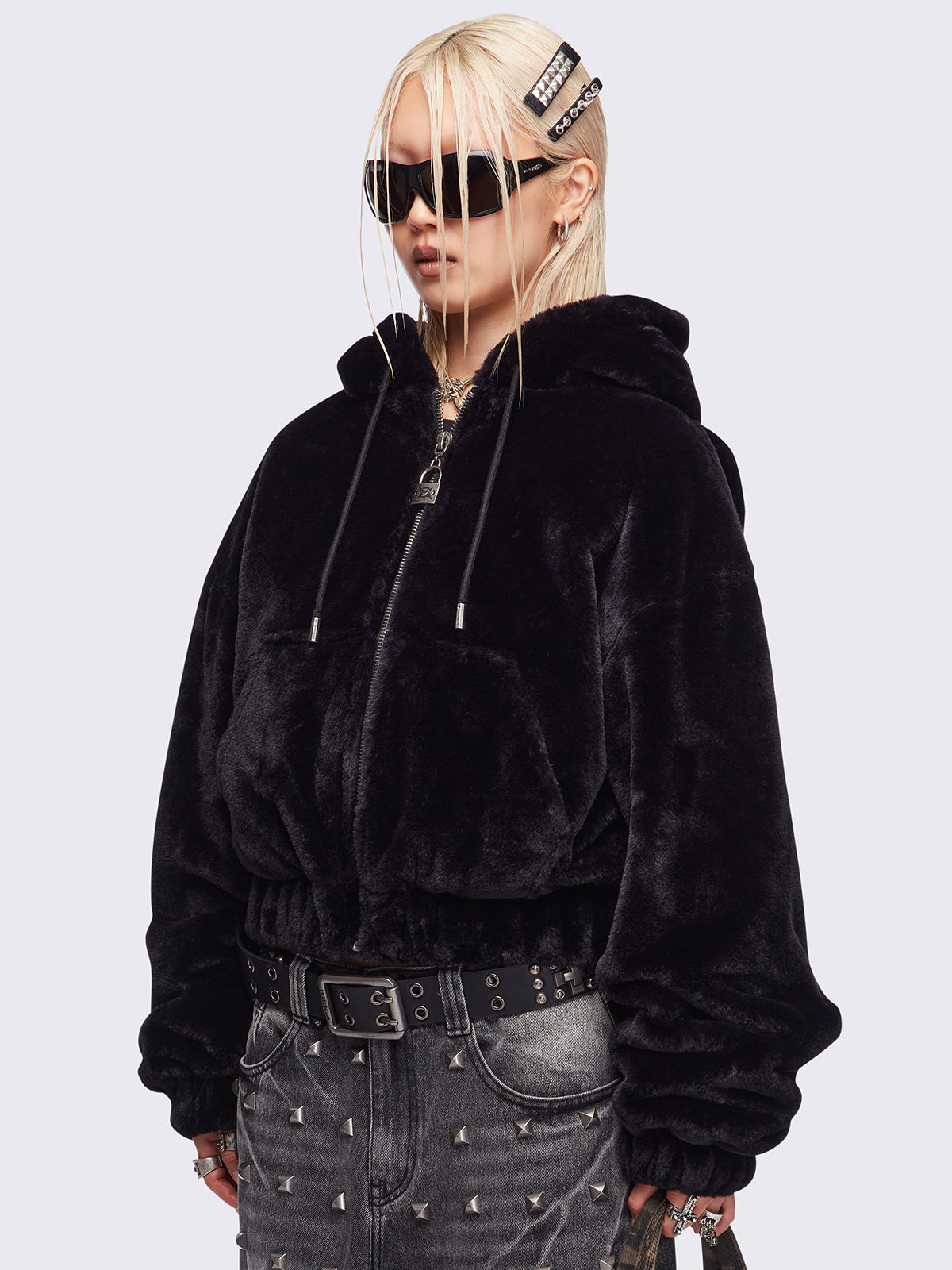 Black oversize faux fur jacket with cat ear hood with piercing details.