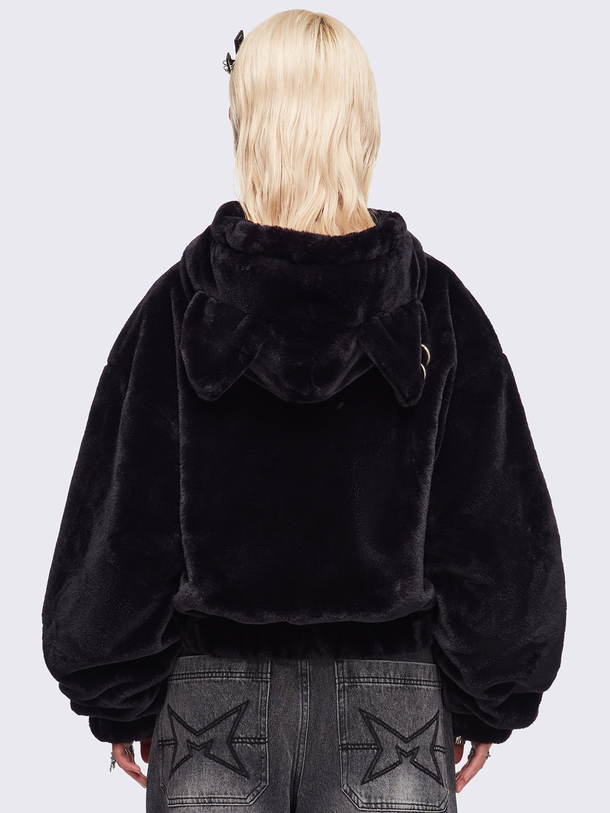 Black oversize faux fur jacket with cat ear hood with piercing details.