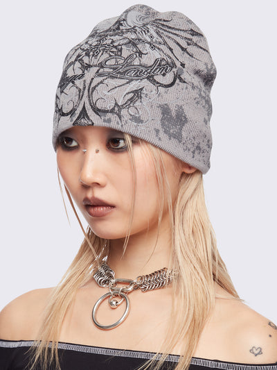 Grey beanie hat with grunge graphic print.