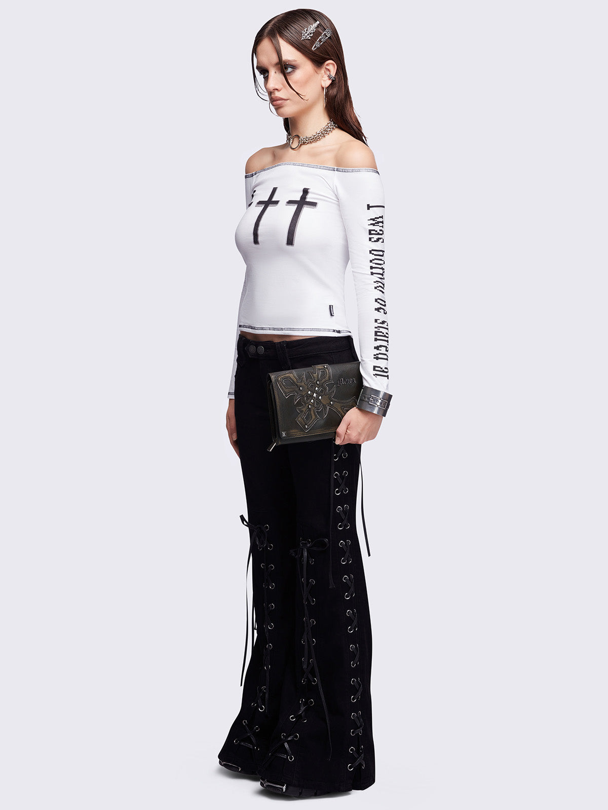 Black washed faux leather wallet featuring a cross patch and stud details.
