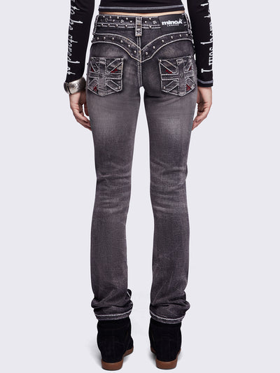 Black washed skinny jeans featuring ripped and stud details, white contrast stitching, embroidered back pocket and raw frayed hems.