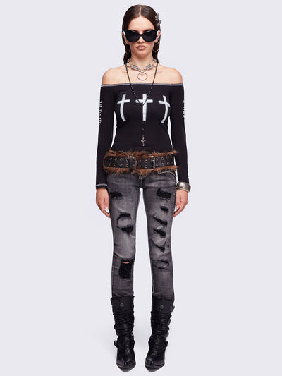 Black washed skinny jeans featuring ripped and stud details, white contrast stitching, embroidered back pocket and raw frayed hems.