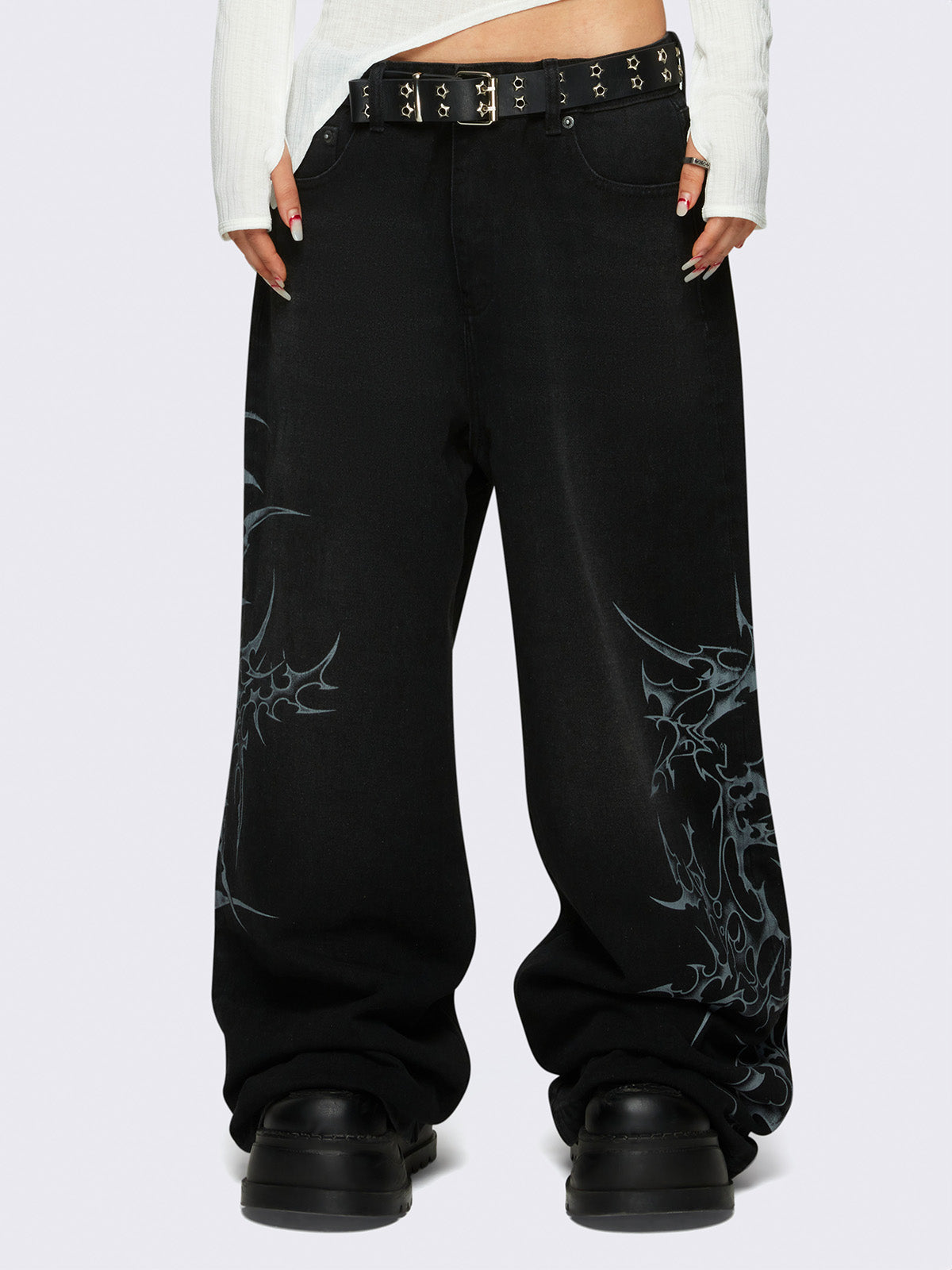 Baggy jeans in black with sigilism graphic print