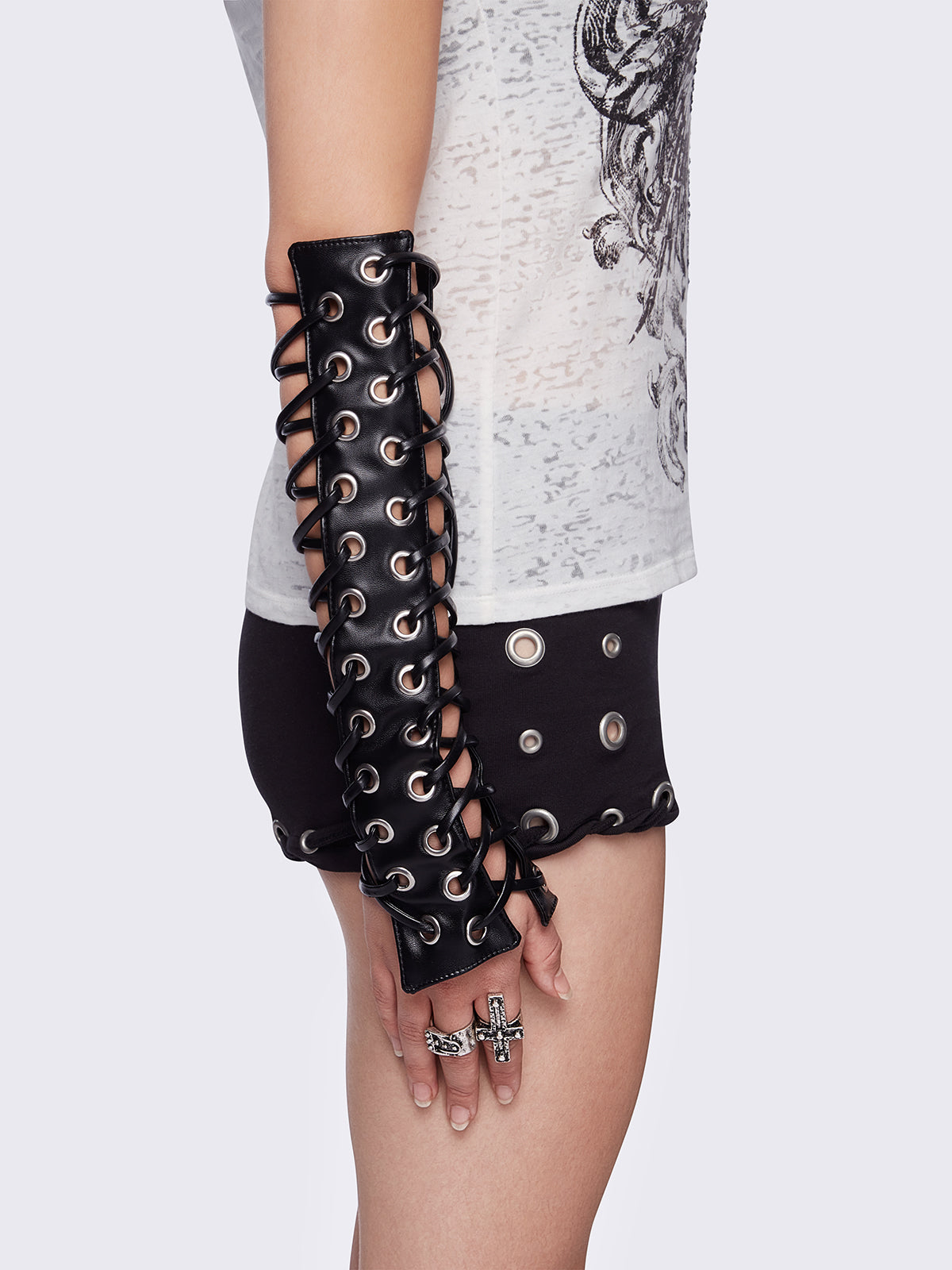 Black faux leather goth arm warmers featuring all over lace up and grommet.