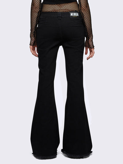 Flared jeans in black with chunky buckle belt