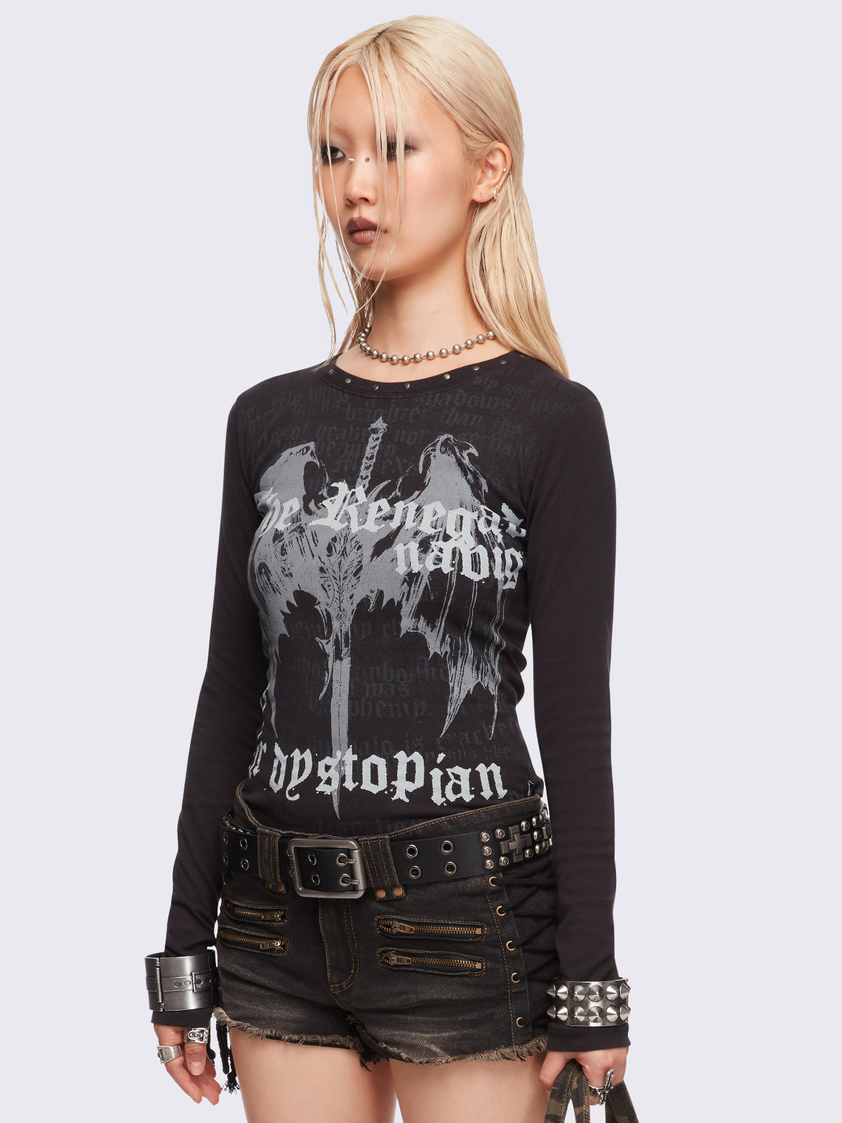 Black long sleeve top featuring a winged dagger and letters graphic print.