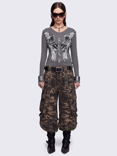 Grey long sleeve top featuring a "Feathers stained with chaos" wings graphic print and v-neck style.