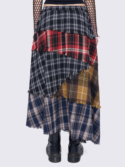 Patchwork tiered maxi skirt with multi-colored plaid panels and frayed trims.