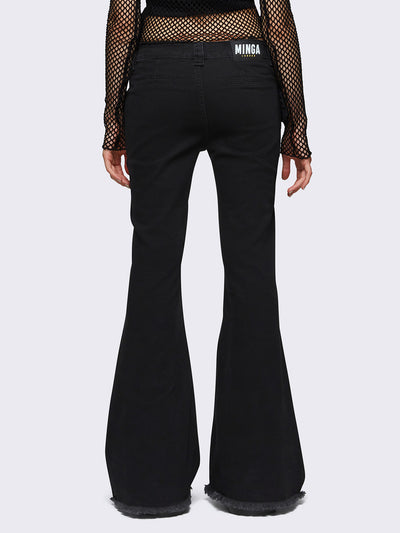 Flared jeans in black with chunky buckle belt