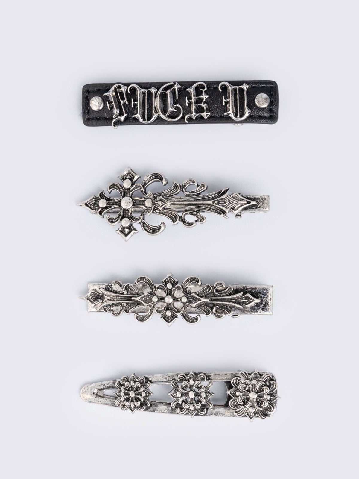 Set of 4 hair clips with silver floral baroque and black PU.