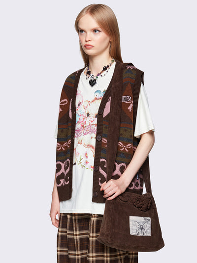 Jacquard knit sweater vest in brown with geometric striped pattern and bows design