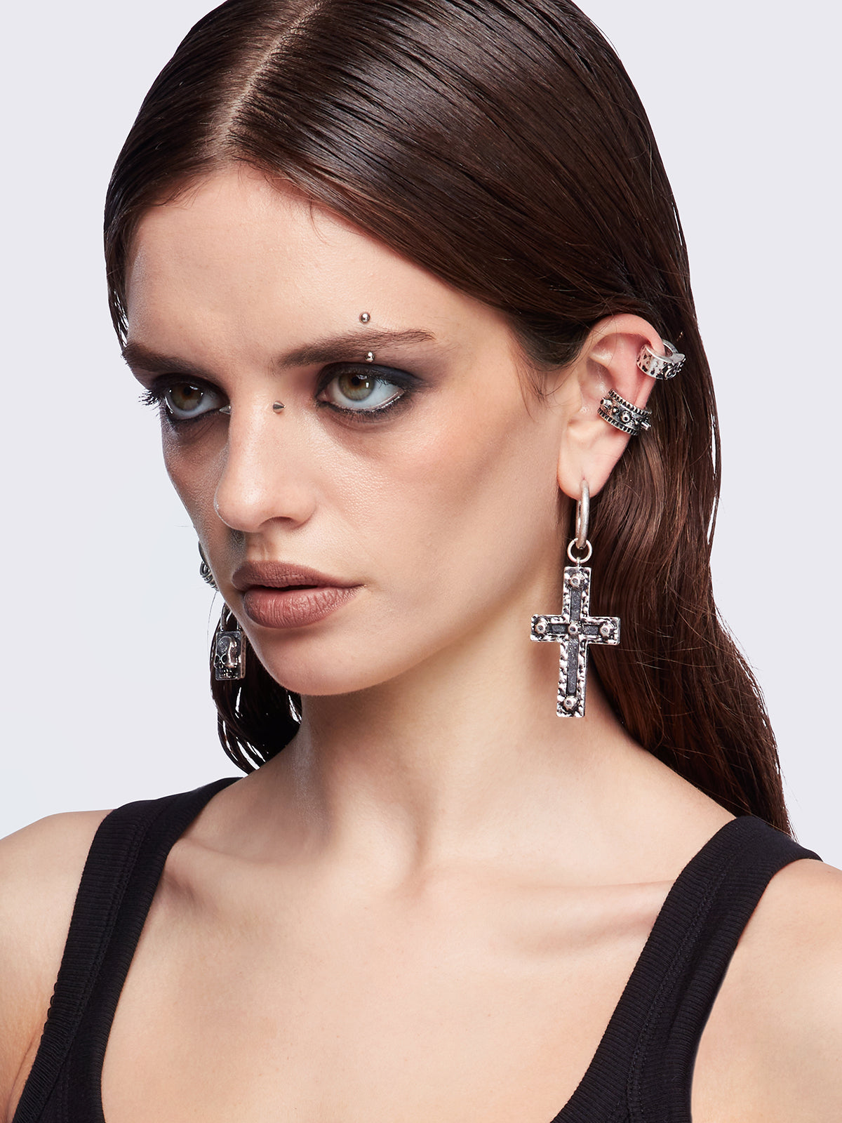 Silver 7pc earring set featuring cross pendants and more styles.