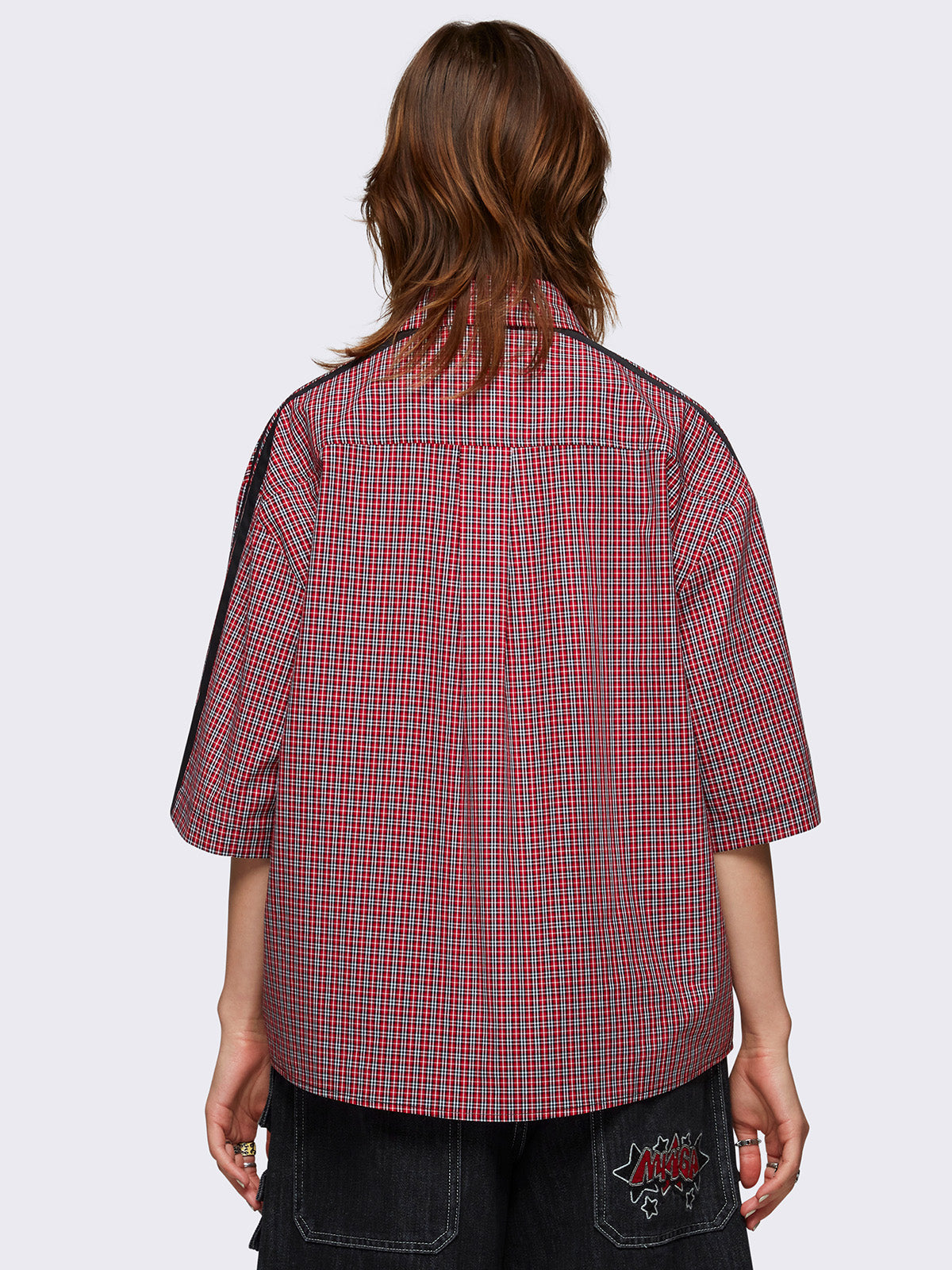 Checkered shirt in red with black star patch