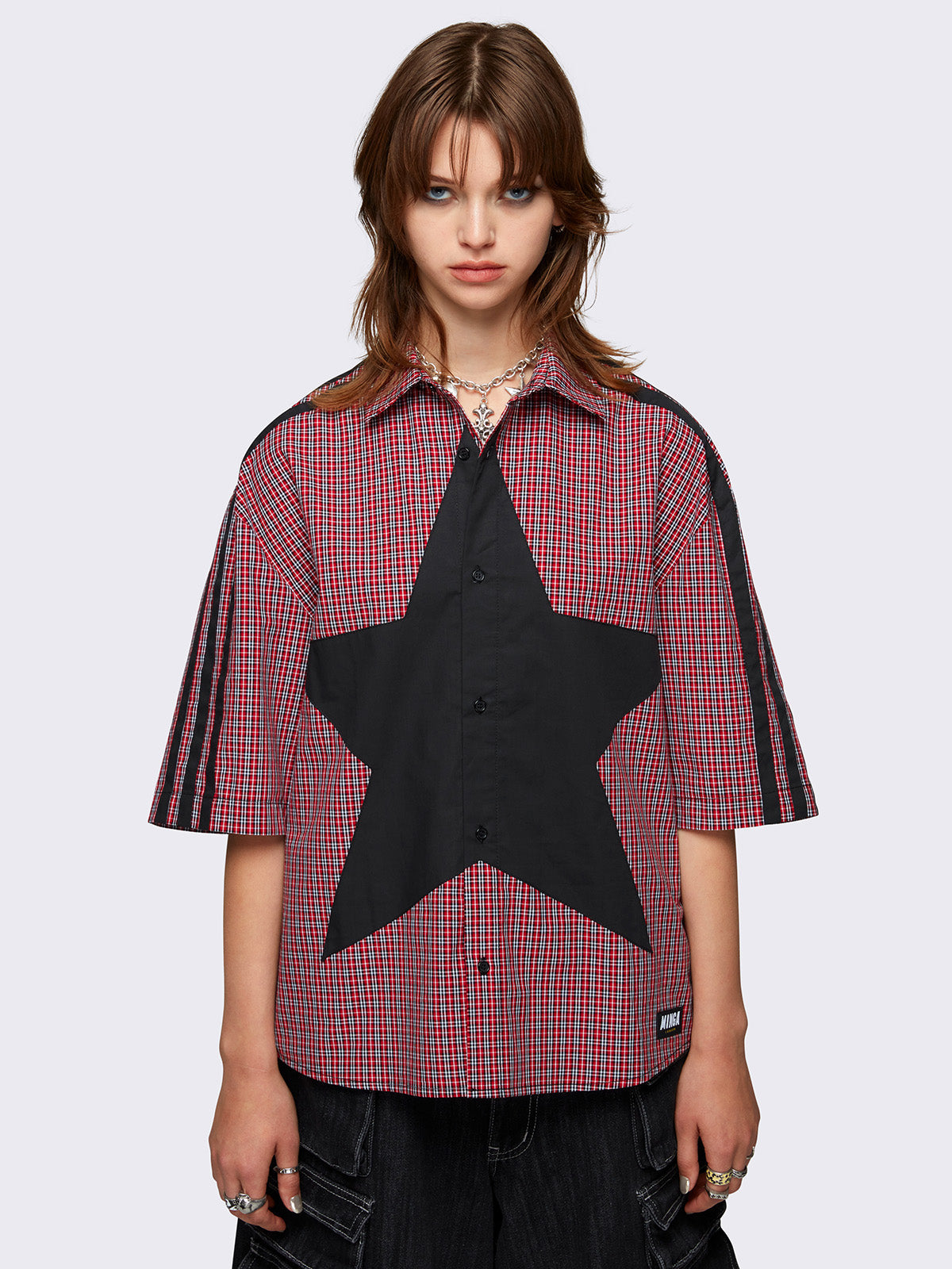 Checkered shirt in red with black star patch