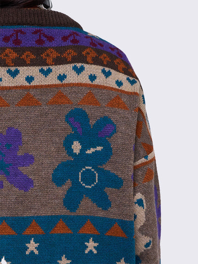 Jacquard knit jumper with playful motifs including teddy bear, stars, cherries and more.