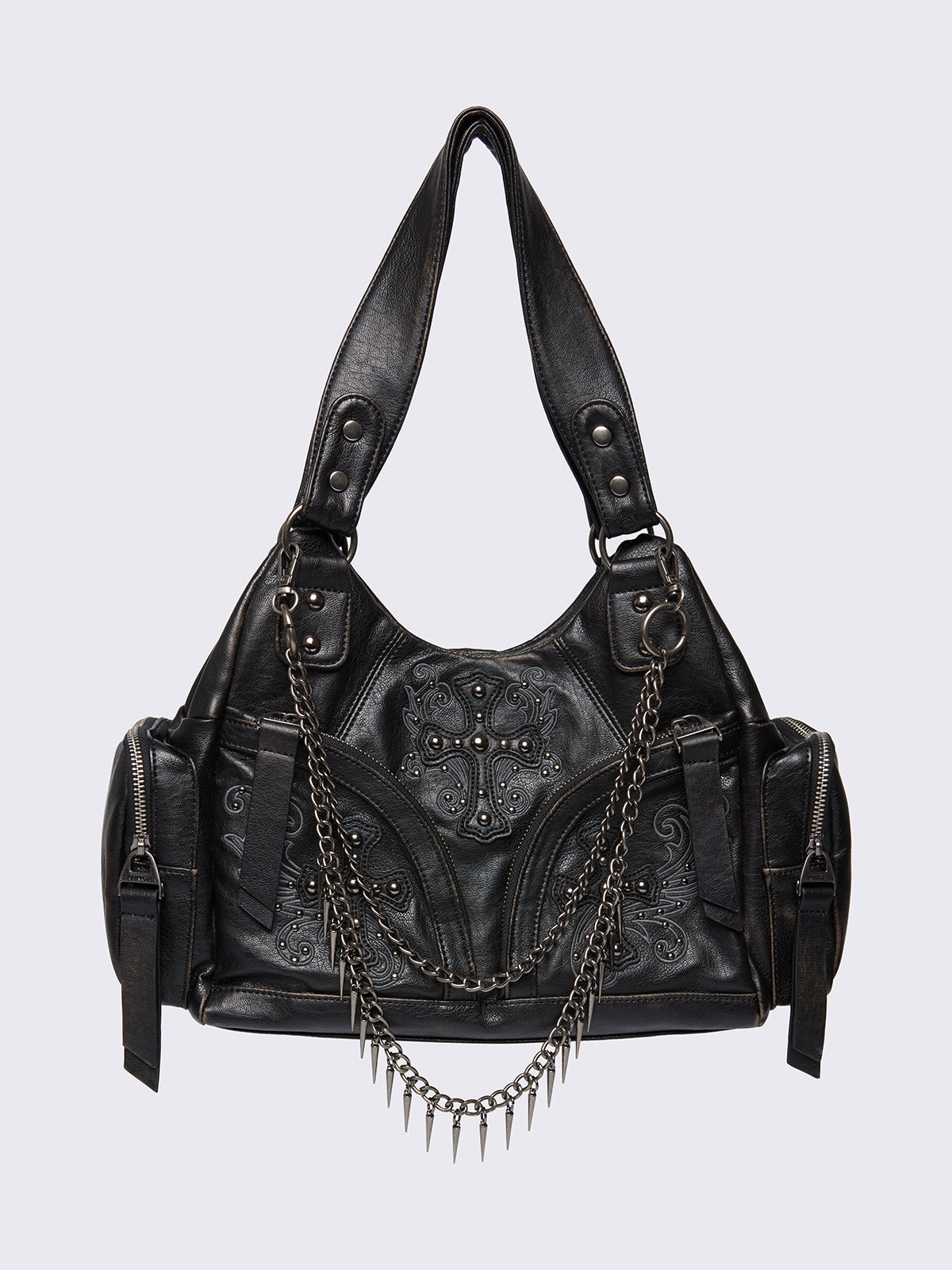 Black faux leather shoulder bag with silver chains, spike charms, side pockets, and embroidered cross detail on the front.