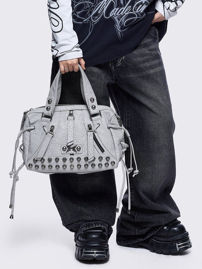 White faux leather shoulder bag with stud, lace up and metal hardware details