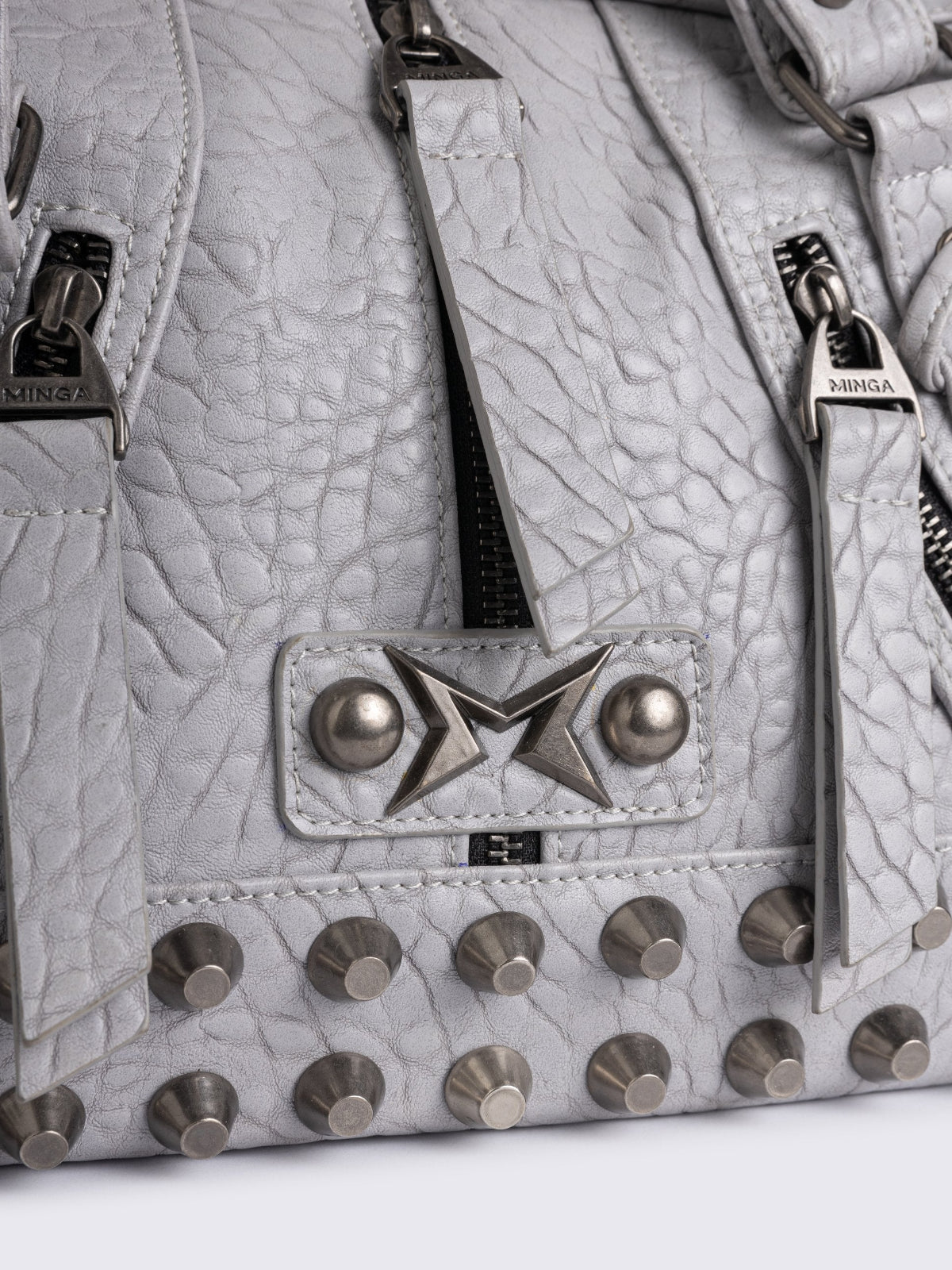 White faux leather shoulder bag with stud, lace up and metal hardware details