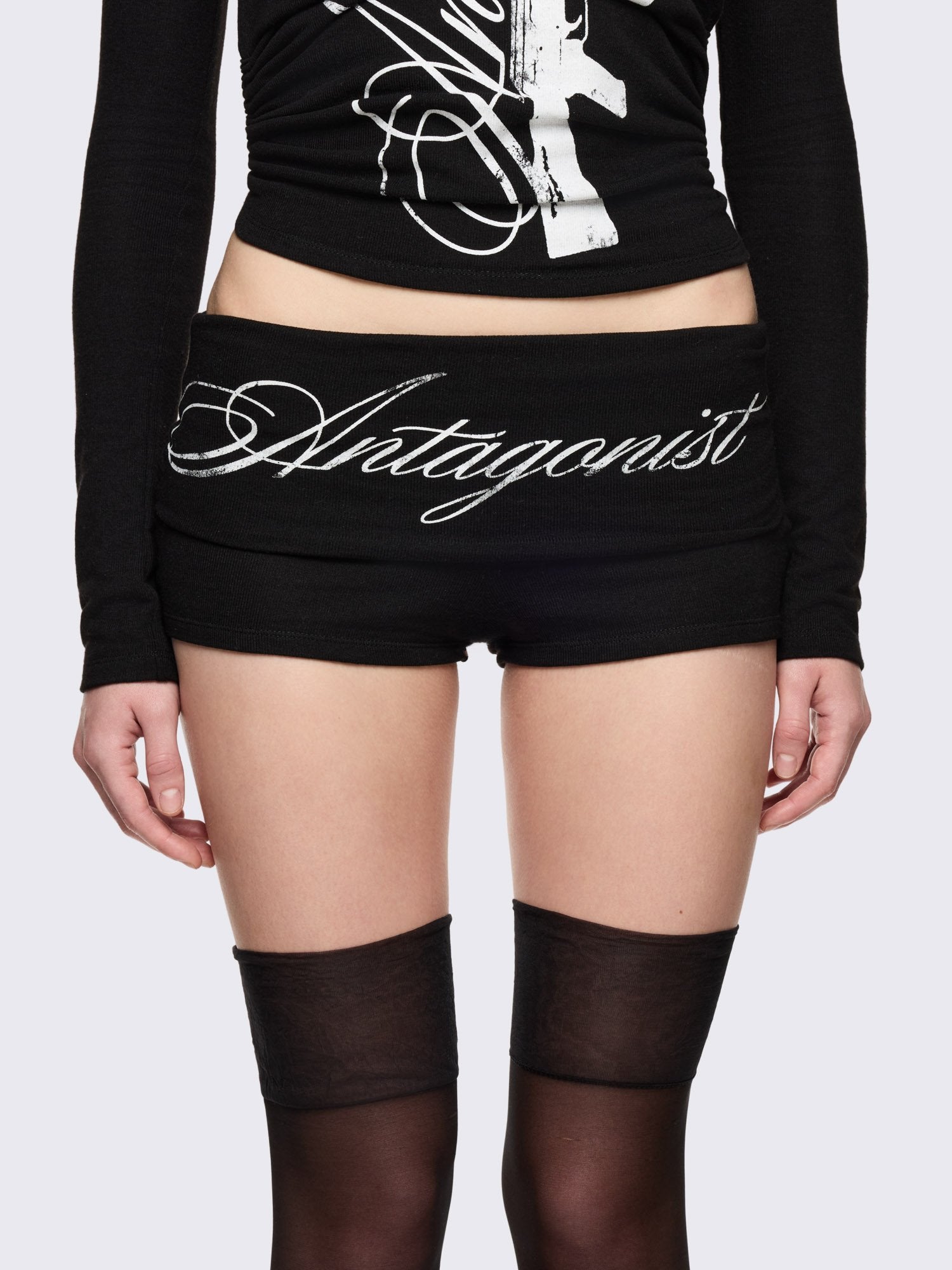 Black sweat hot pants and "Antagonist" front and a gun on back prints.