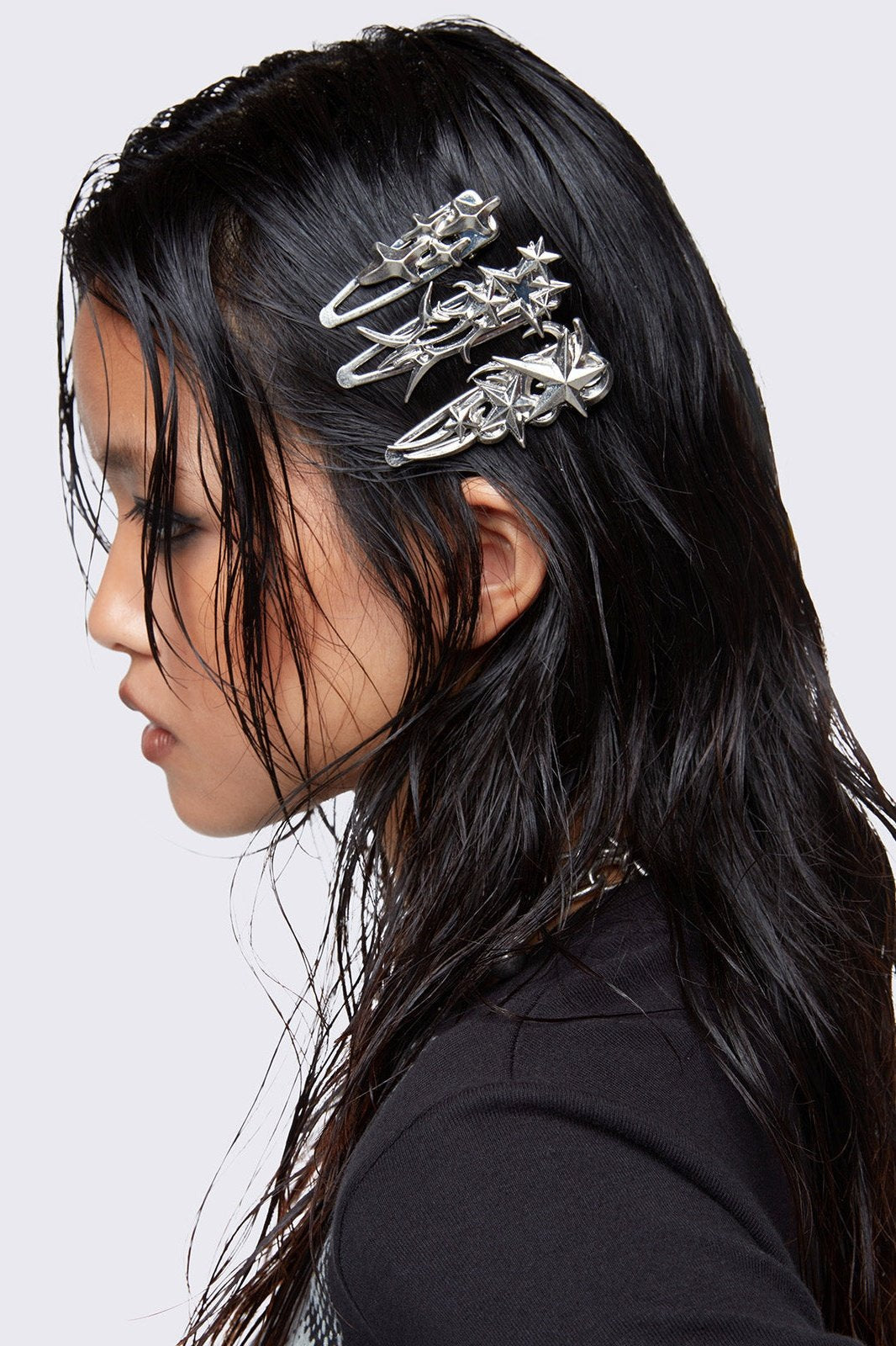 Silver hair clip 3 pieces set with stars design. 