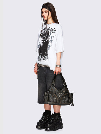Off-white oversized t-shirt with black kitty graphic front print and eyelet neckline and hem details.