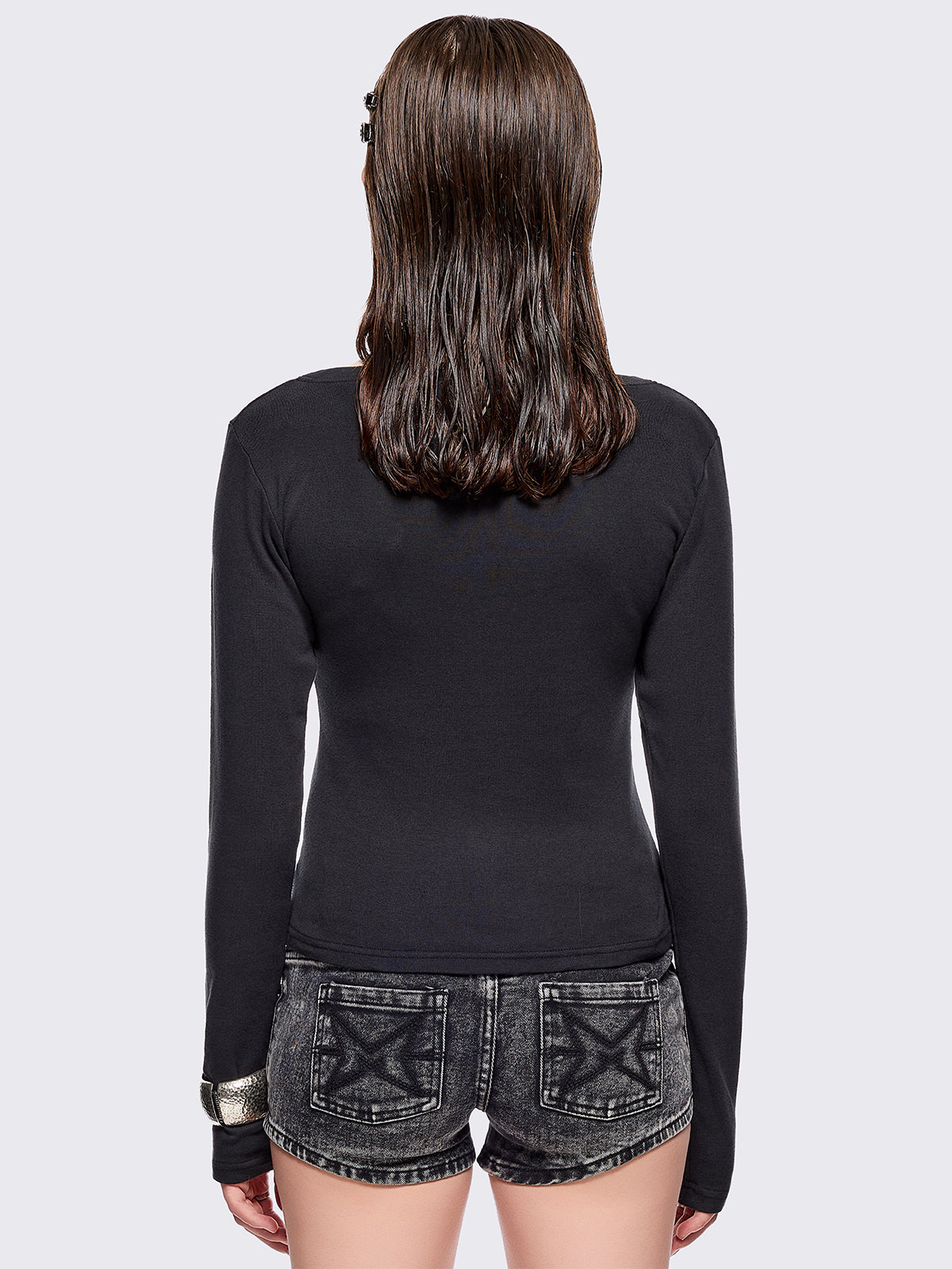 Black long sleeve top with grunge graphic and crosses graphic front print.