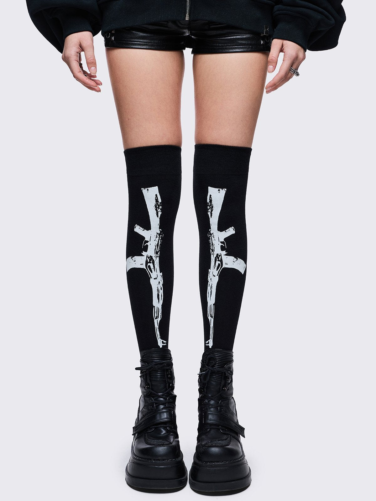 Black opaque thigh highs socks with white gun graphic design 