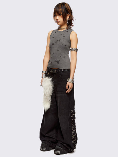 Black washed super baggy jeans with silver chunky eyelets along sides with O-rings. Oversized fit.