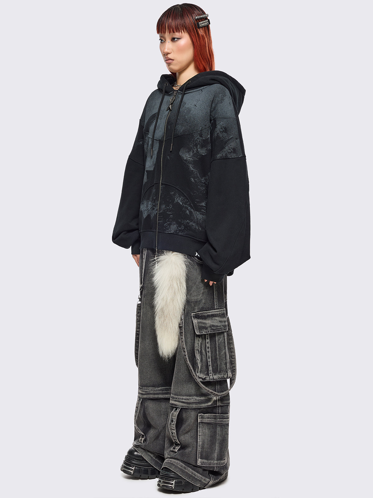 Black zip up hoodie jacket with grunge graphic print.
