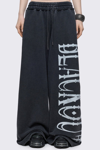 Washed Black Baggy Graphic Sweatpants | Minga London